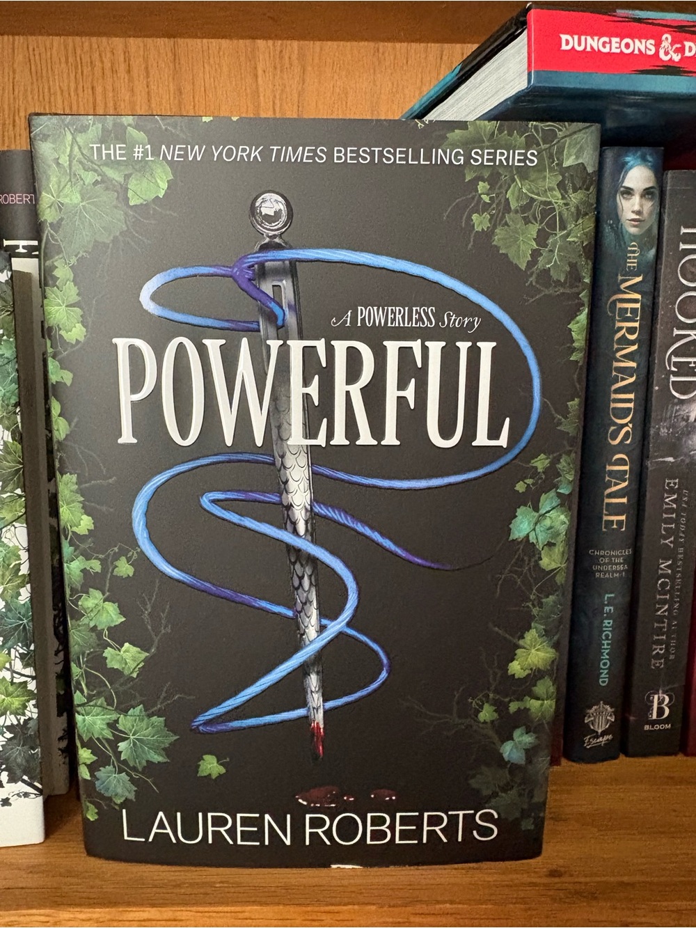 Powerful by Lauren Roberts — Black Book Cover with Blue Accents